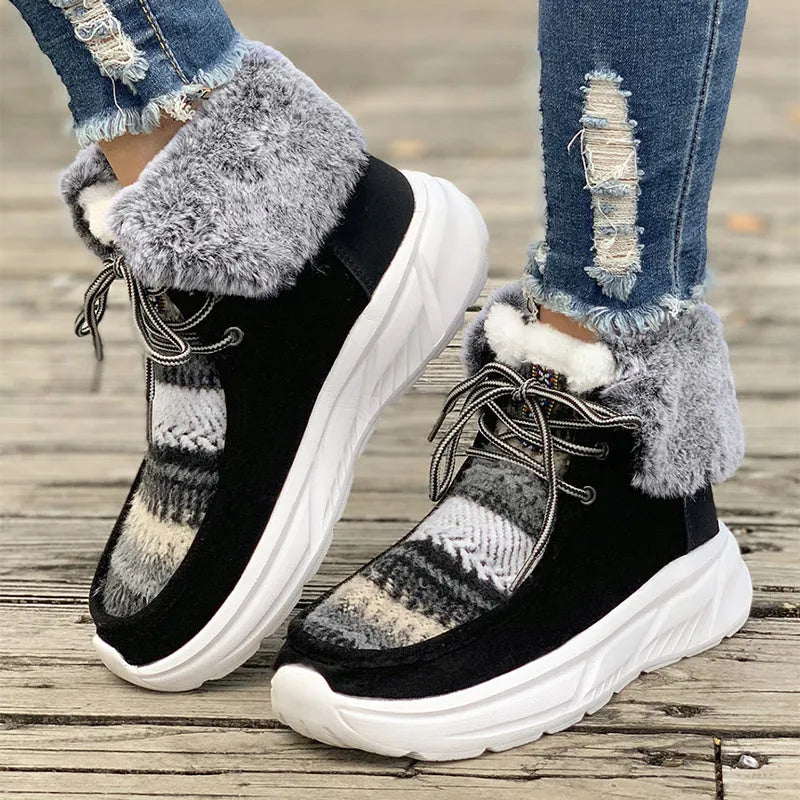 Beige women's lace-up suede snow boots with fuzzy finish and thick rubber sole.