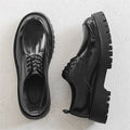 Platform height increasing casual leather shoes in black with round toe and front lace-up closure