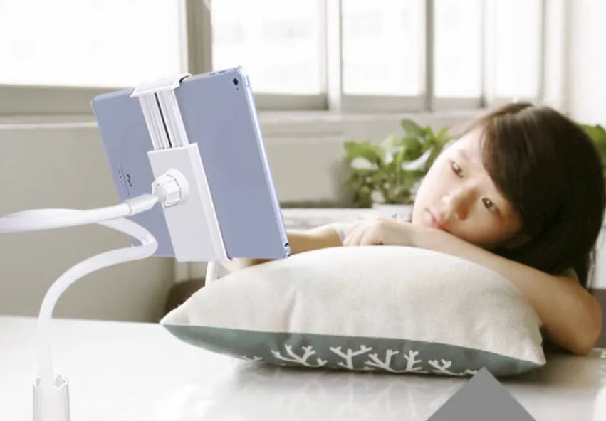 Blue universal mobile phone and tablet holder with 120cm pole on a bedside table