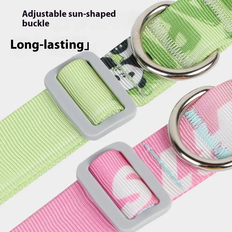 Adjustable nylon dog collar with vibrant cartoon gradient print and metal D-ring on a green background.