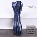 Spools of PU leather crafting cord in multiple colours including black, red, blue, and gold, showing different thicknesses.