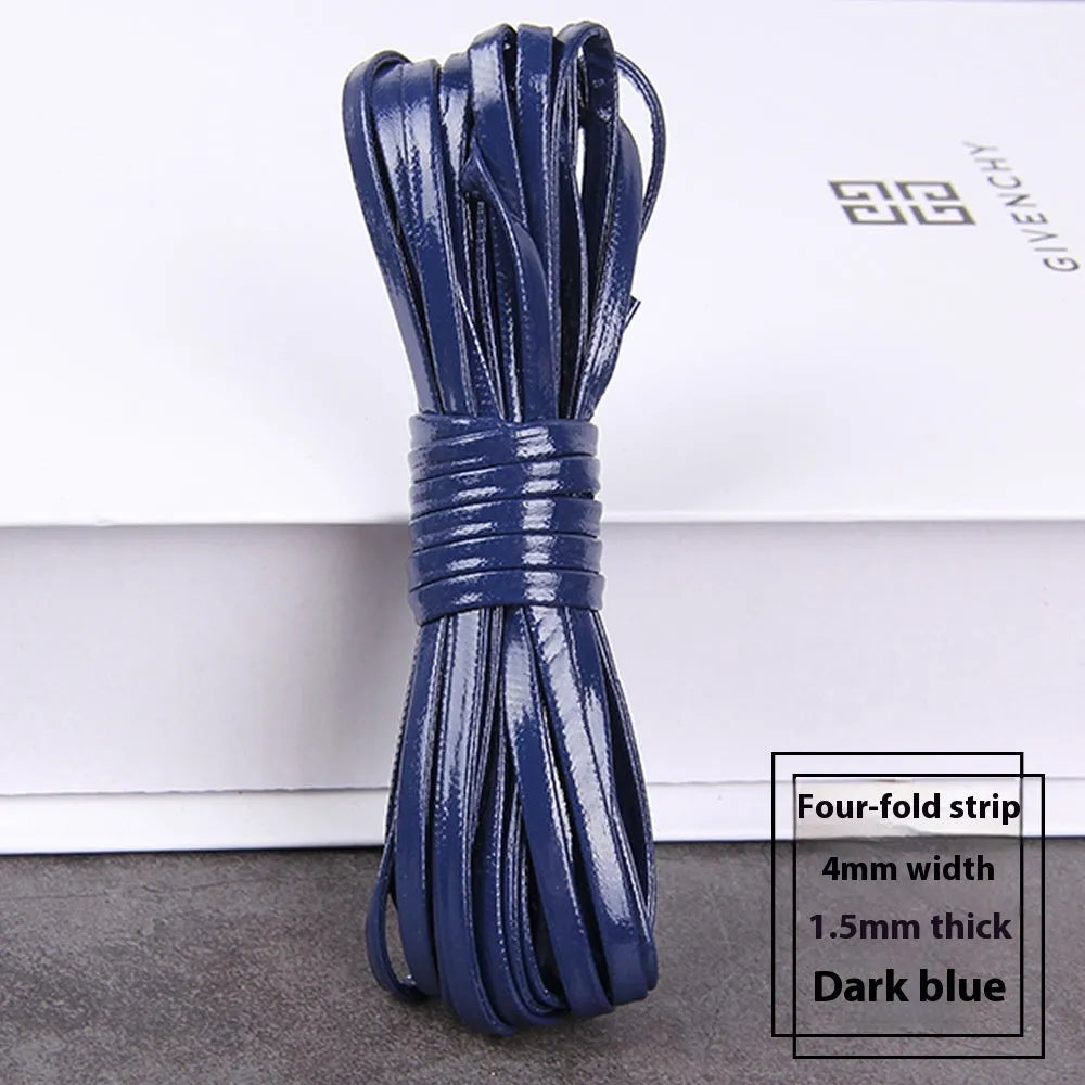 Spools of PU leather crafting cord in multiple colours including black, red, blue, and gold, showing different thicknesses.