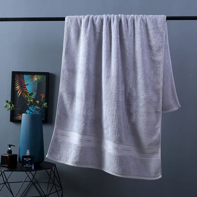 Pure cotton bath towel set showing three pieces in blue colour with floral pattern detail