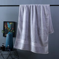 Pure cotton bath towel set showing three pieces in blue colour with floral pattern detail