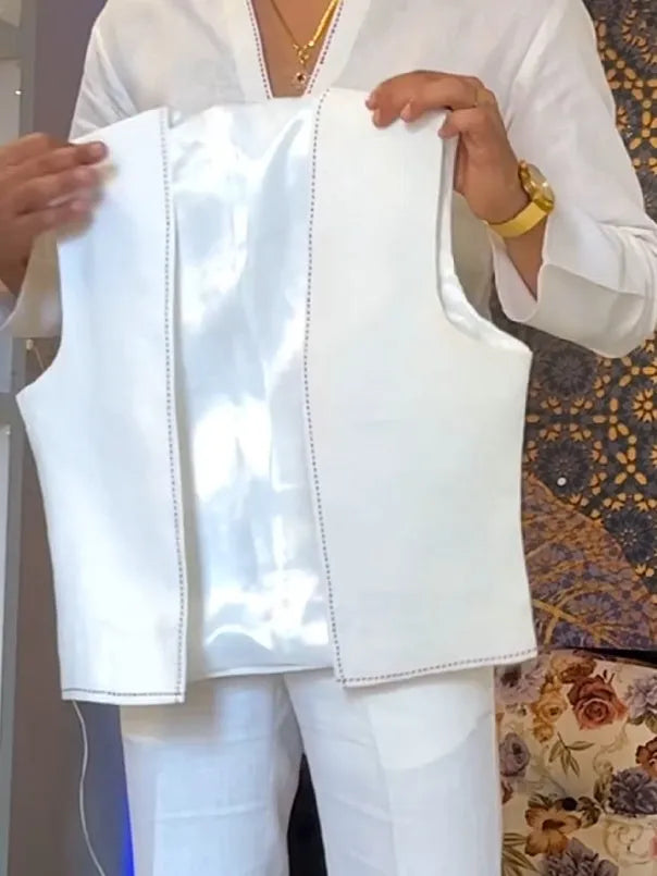 White polyester three-piece men's outfit showing V-neck shirt, sleeveless vest, and full-length trousers