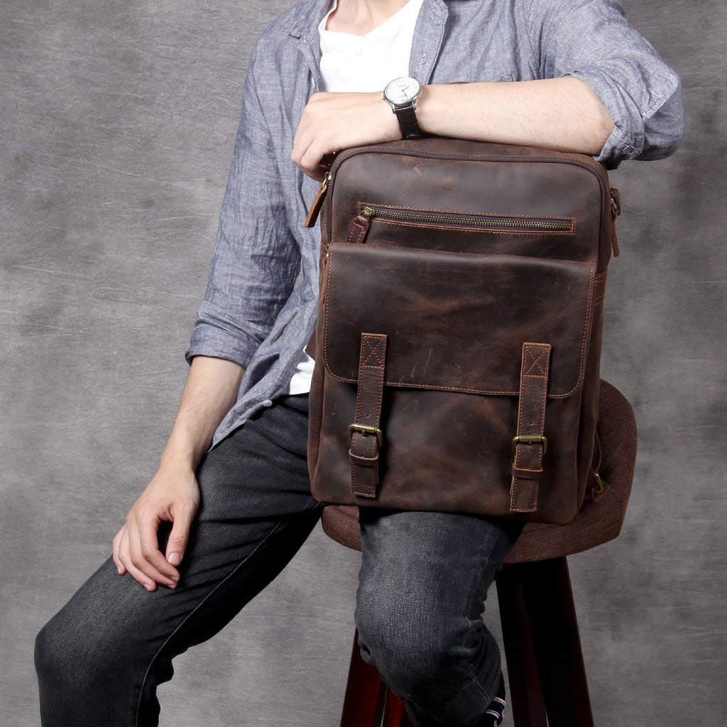 Dark coffee coloured handmade leather backpack with internal organiser compartments.