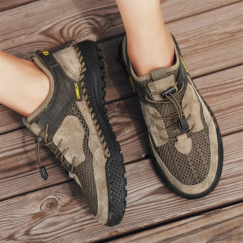 Men's brown suede casual shoes with elastic band closure and hand-stitched sole.