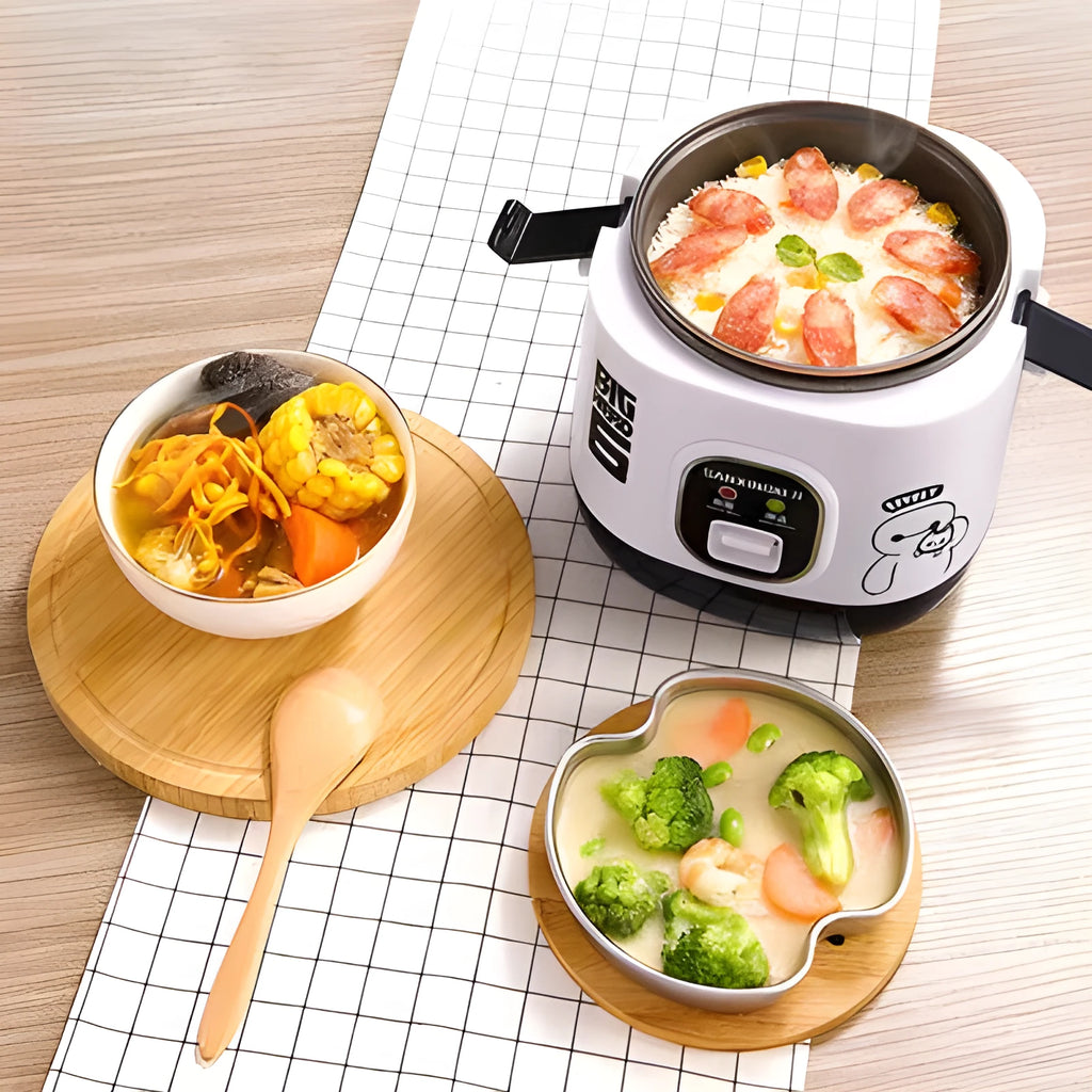Small blue and white automatic rice cooker with steam pan on a kitchen counter.