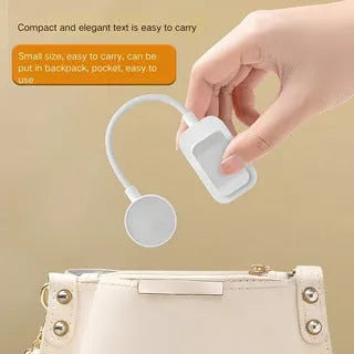 Portable rechargeable clip light in modern simplicity style clipped onto a desk for reading