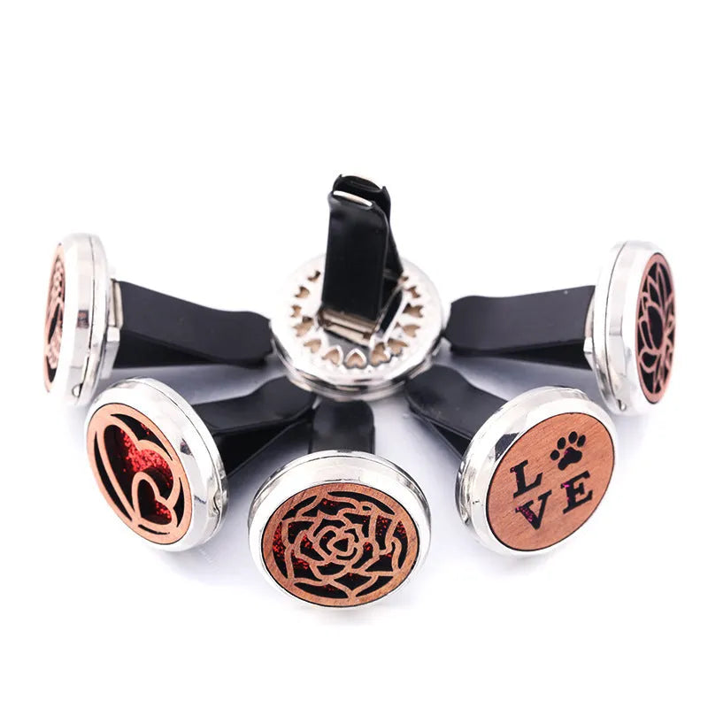 Round car vent aromatherapy clip in alloy wood construction showing hollow centre for incense