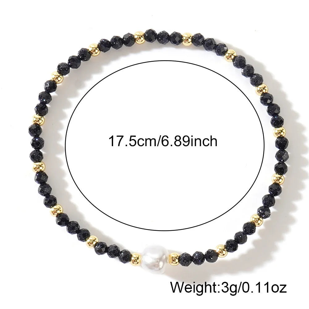 A unisex natural stone bracelet with elliptical geometric beads on a wrist, shown in one of the multiple available colours.