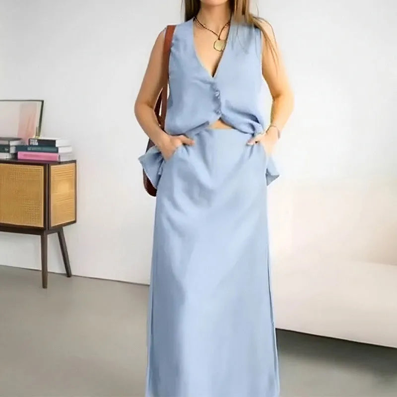 Women's blue casual two-piece set featuring a sleeveless vest and a long, loose-fitting skirt.