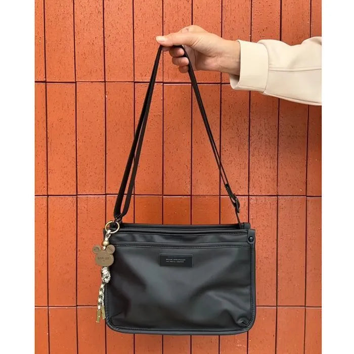 Retro-style small square crossbody bag in Oxford cloth for unisex casual and travel use