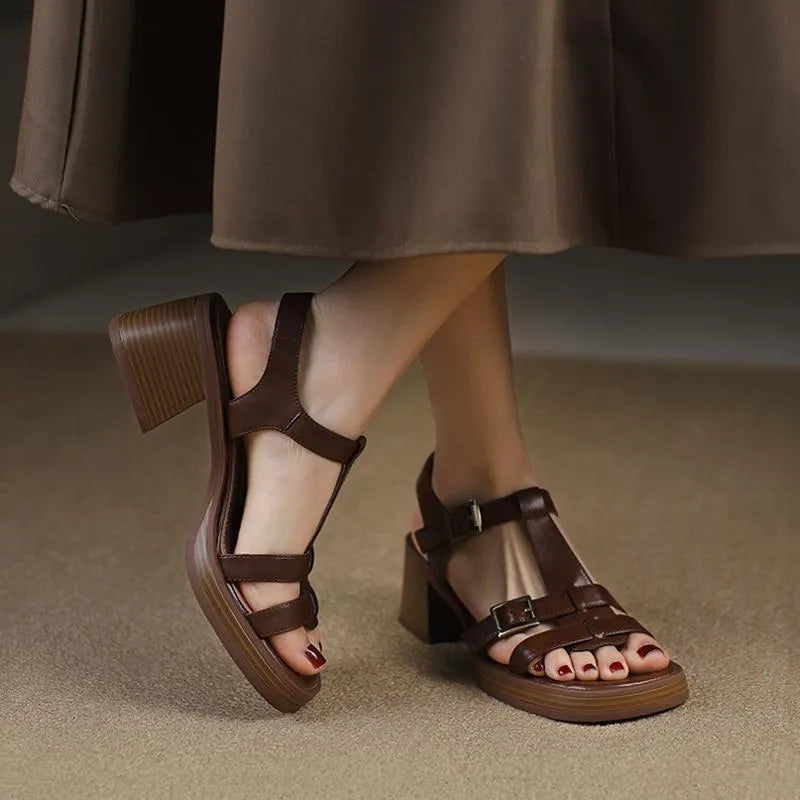 Black women's retro sandals with a T-buckle strap, chunky platform heel, and open square toe