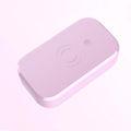 White ultraviolet disinfection box with wireless phone charging pad for nail tools.