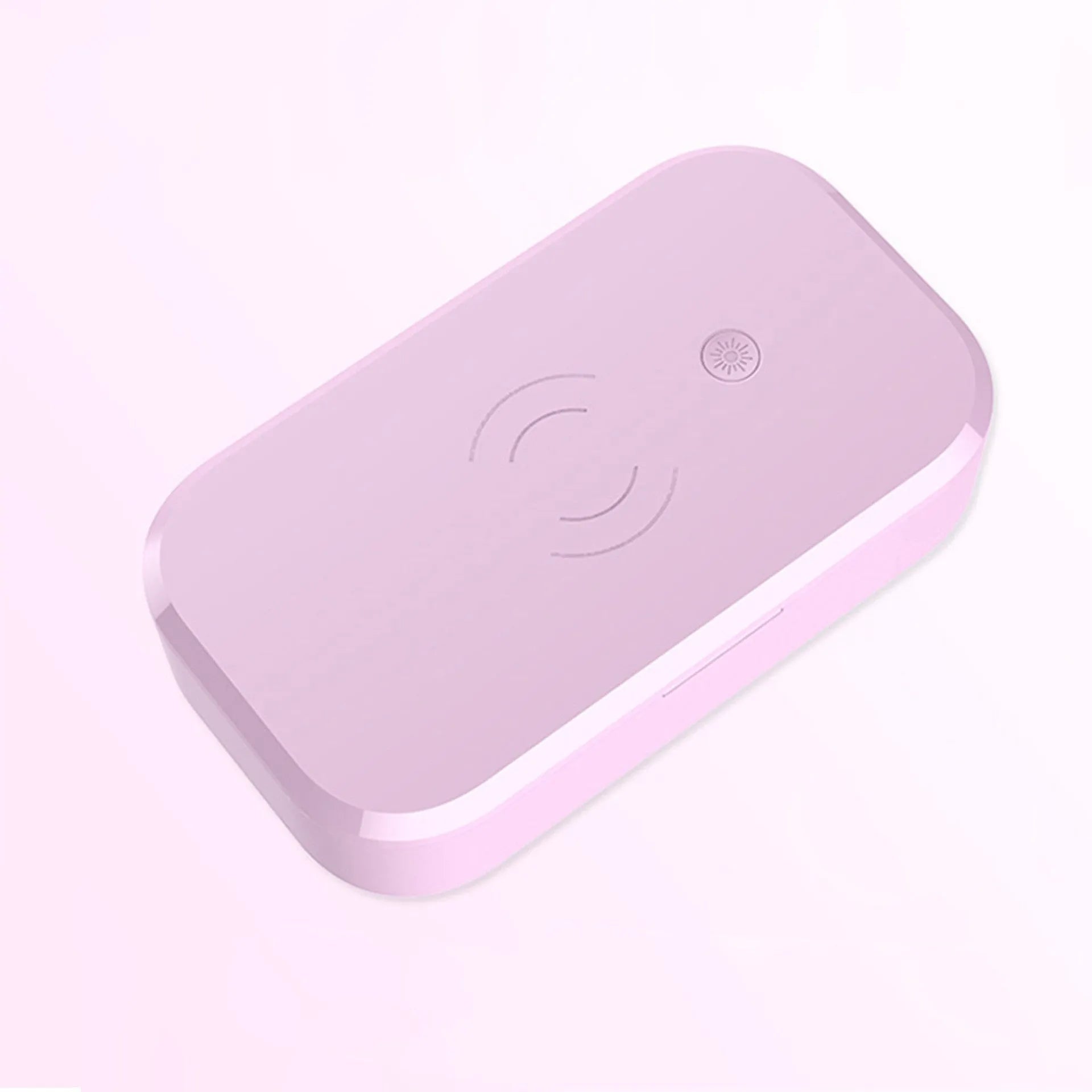 White ultraviolet disinfection box with wireless phone charging pad for nail tools.