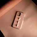 Pink eye-shaped phone case in waxed vegetable-tanned cowhide with PC bottom shell for iPhone