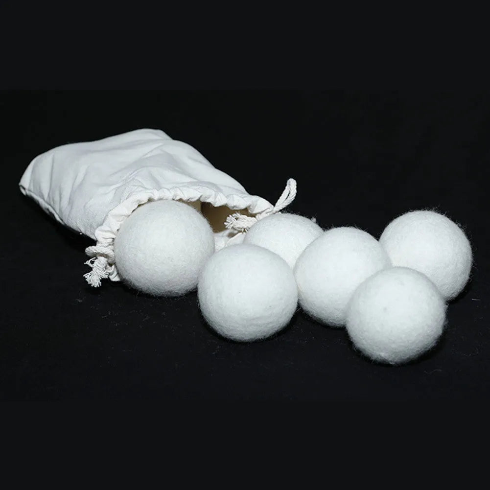 Wool laundry drying ball in various sizes with cotton storage bag for tumble dryer use