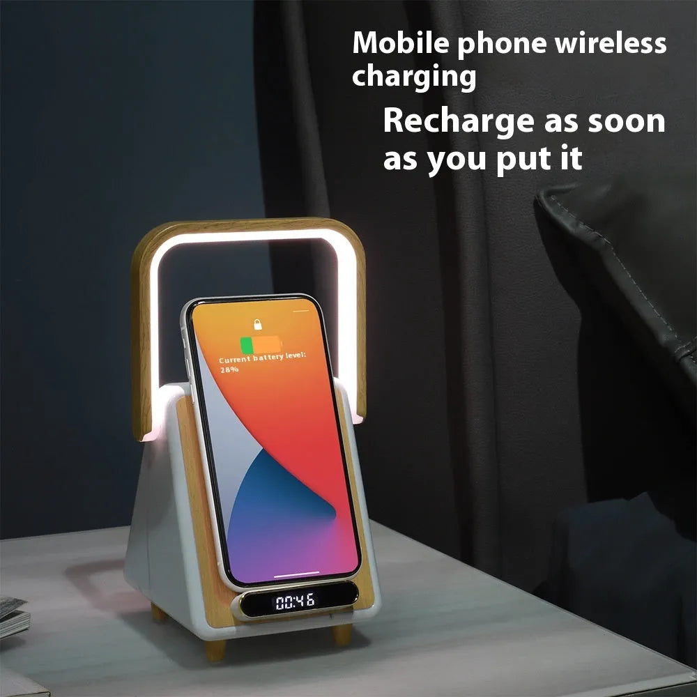 Wireless charging induction Bluetooth speaker small night lamp in Platinum Jazz finish on a wooden surface.