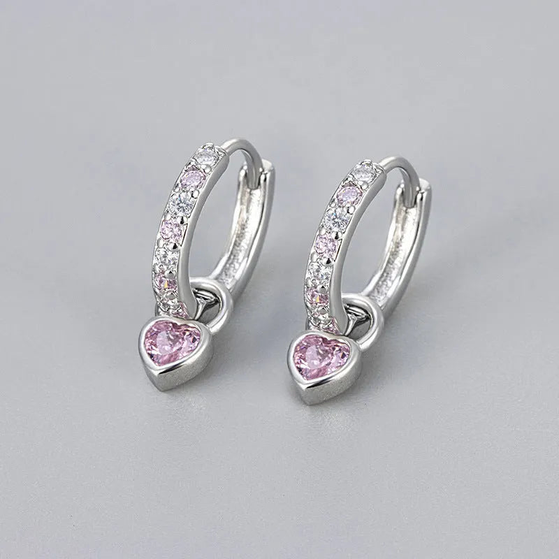 Gold-coloured clip-on earring for women with a heart-shaped drop featuring a pink zircon stone.