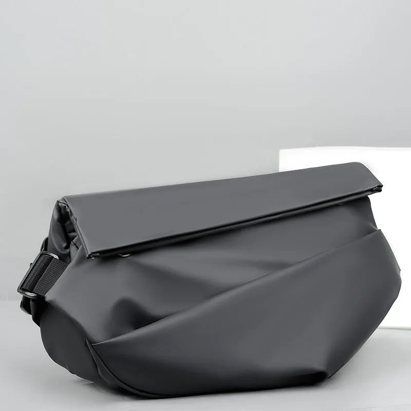 Grey men's PU leather crossbody bag showing front zipper and adjustable strap.