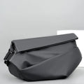 Grey men's PU leather crossbody bag showing front zipper and adjustable strap.