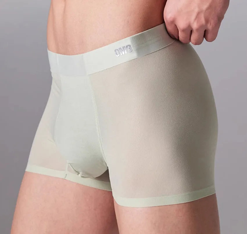 Man wearing seamless grey fitness shorts with antibacterial finish, sizes up to 3XL.
