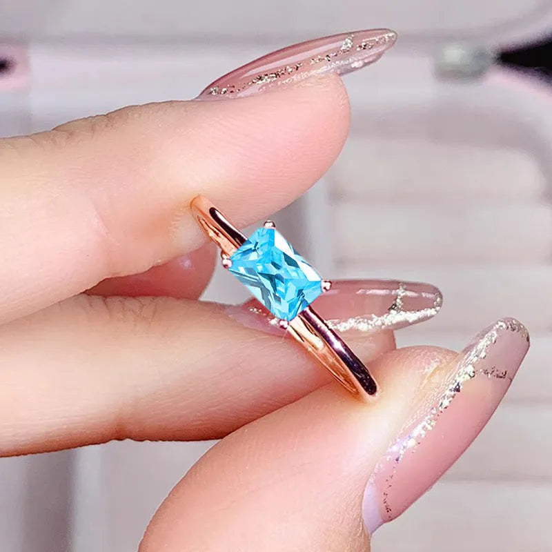 Sapphire blue zircon geometric bracelet ring for women on copper, showing oval and love shapes.