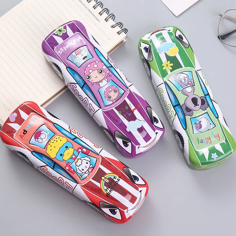 Red and blue cartoon race car design metal pencil case with double-layer trolley shape, shown with pens inside.