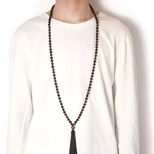 Long geometric agate tassel necklace with multi-coloured stones on a white background.