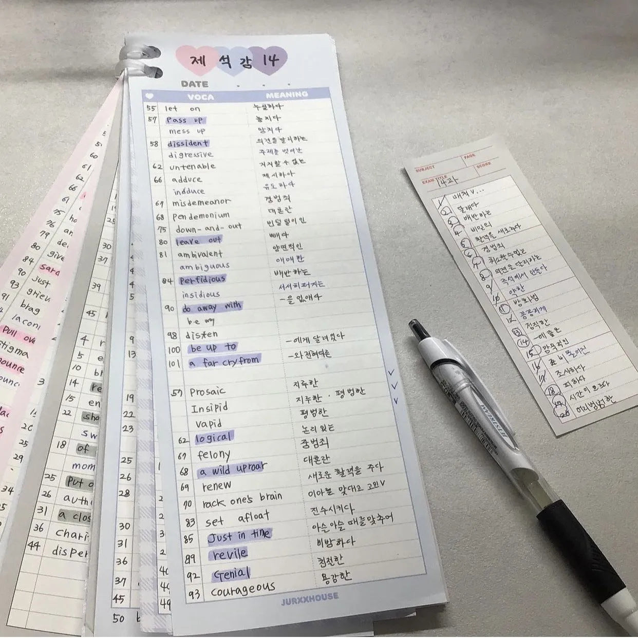 Vertical half-B5 notepad with blue cover, showing 30 pages for English word lists.