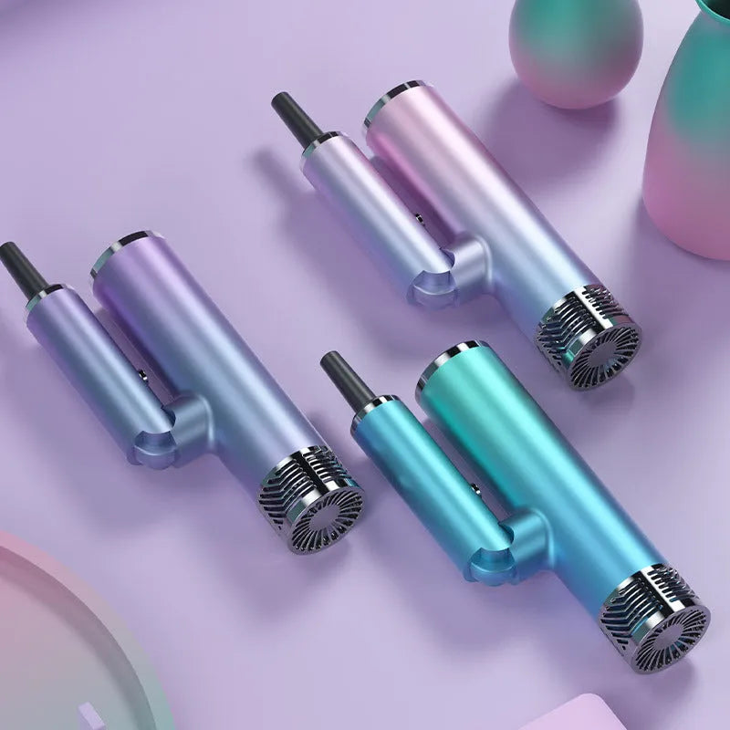 Green foldable hair dryer with collapsed handle next to a purple one, showing compact travel design.