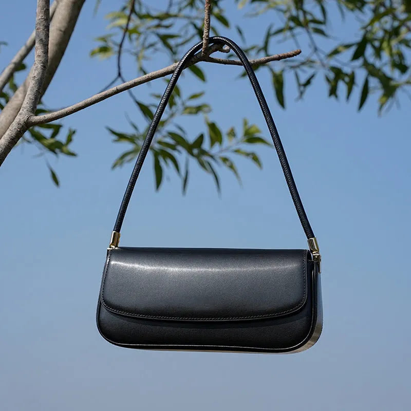 Genuine leather women's saddle bag in caramel, horizontal square shape with double shoulder straps