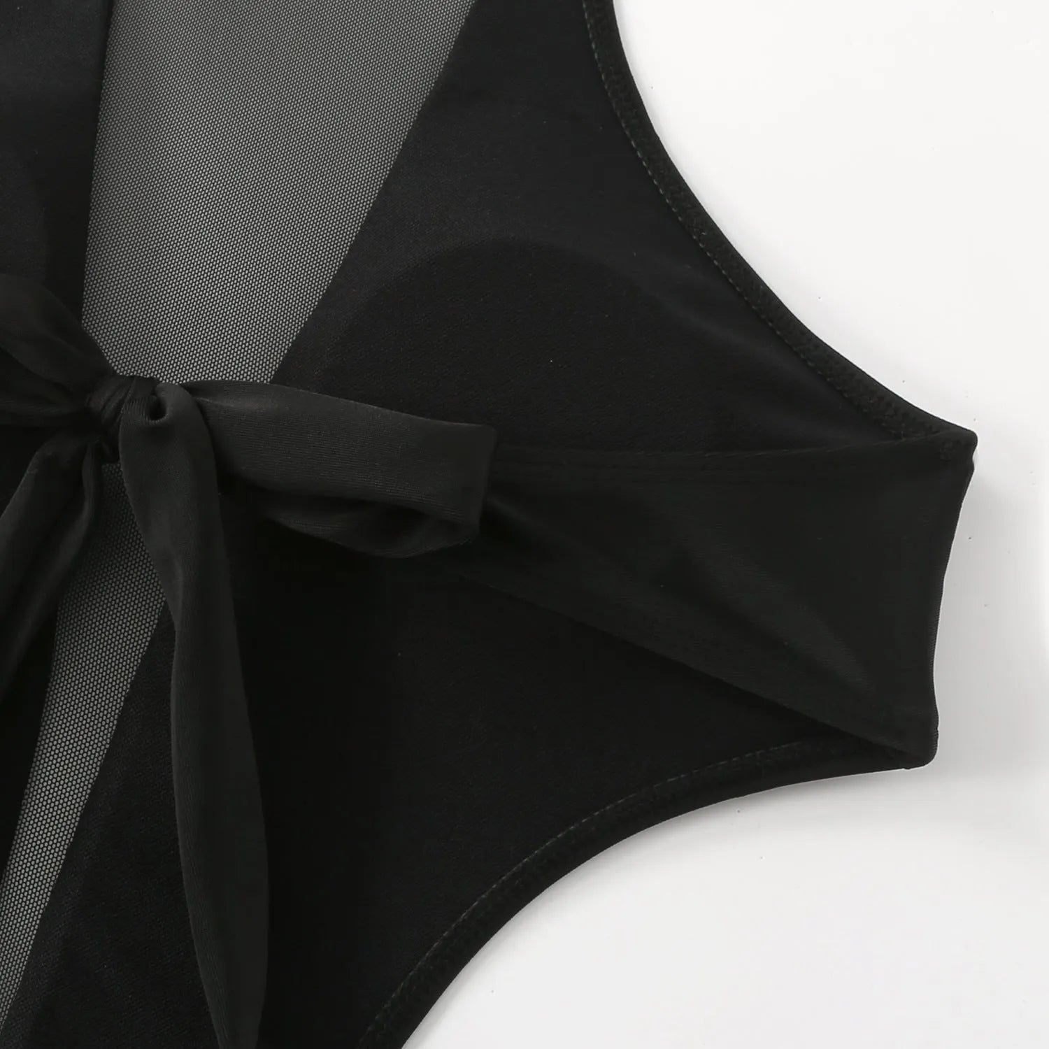 Black one-piece swimsuit with nude back design and hollow-out detailing on female model