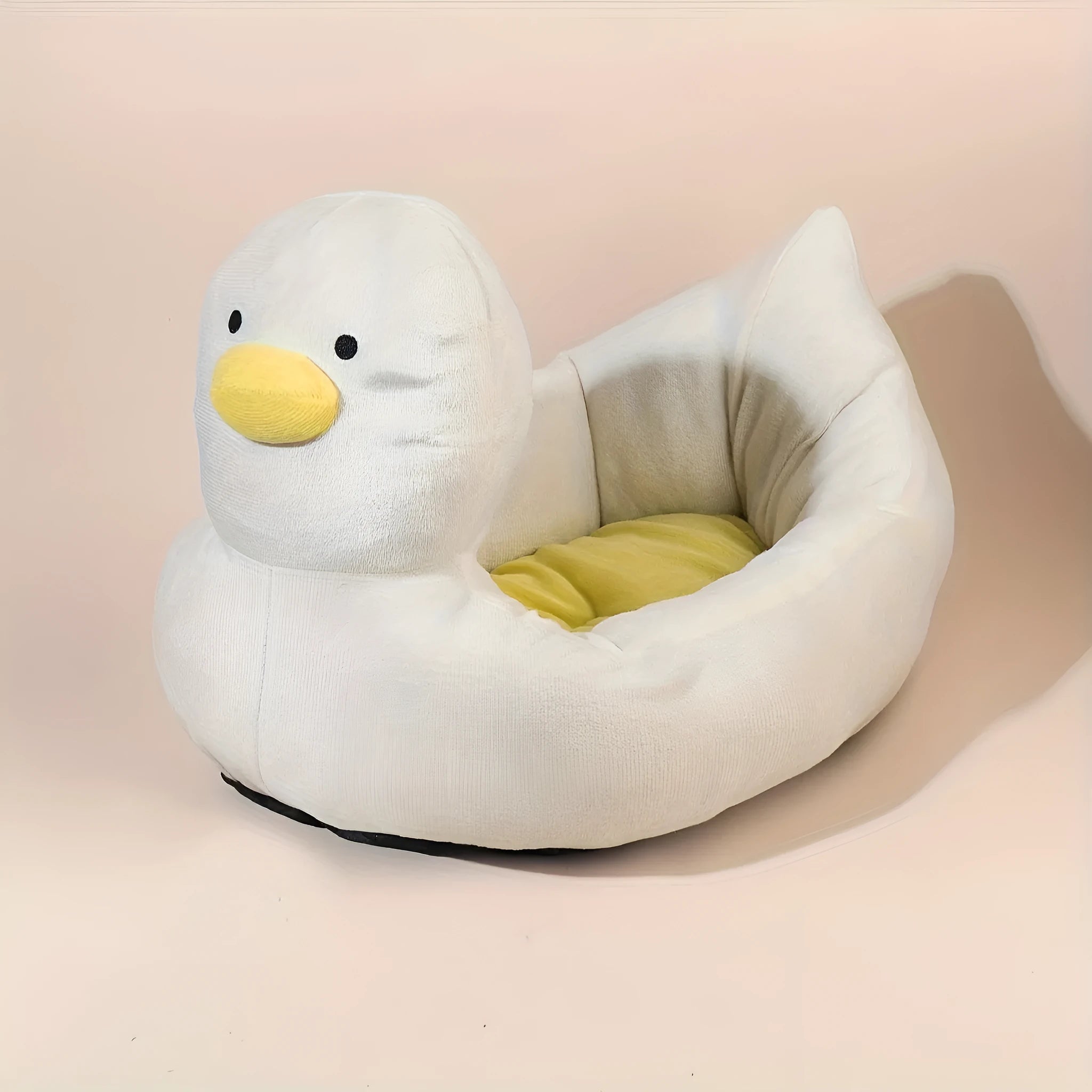 Blue duck-shaped fluffy pet bed for a small dog, showing raised rim and soft material.