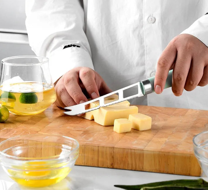 Kitchen utensil set with stainless steel heads and plastic handles including grater, whisk, and can opener