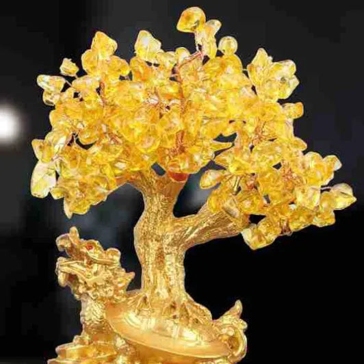 Citrine-coloured resin money tree Feng Shui ornament with a small water turtle design.