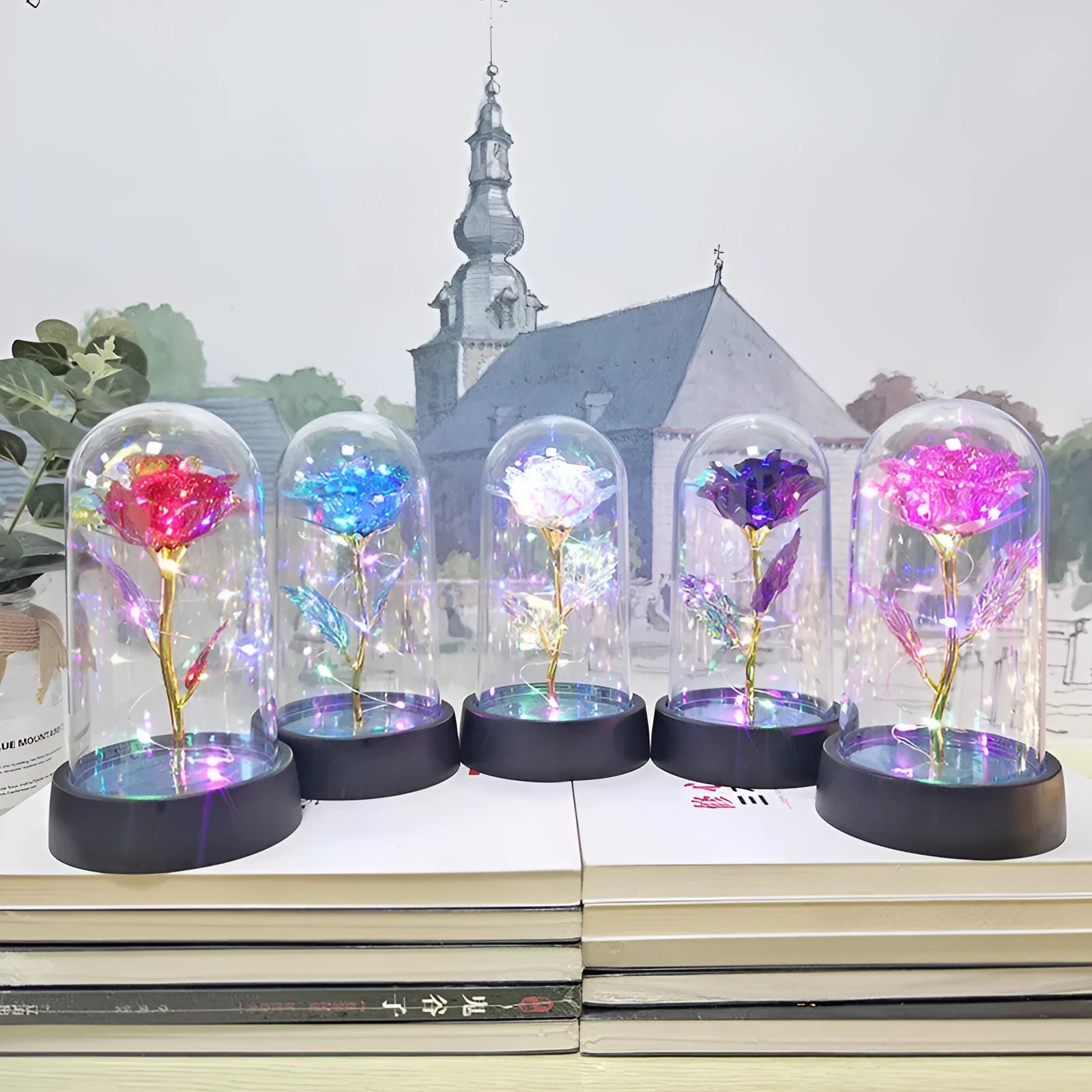 Small glass cover night lamp with plastic base and multiple LED colour options on a table.
