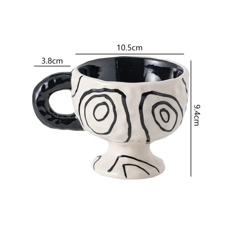Handmade irregular solid colour ceramic mug on a table