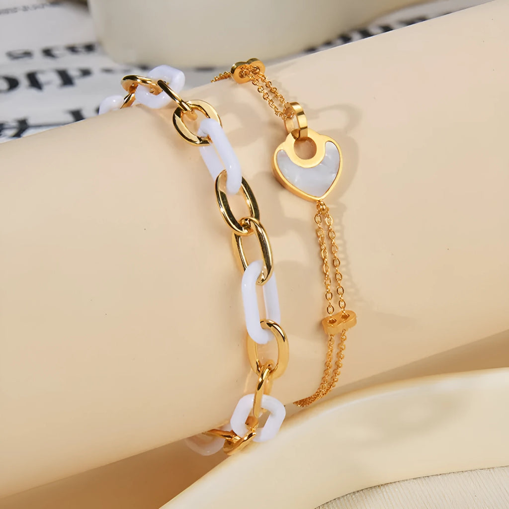 Silver stainless steel bracelet for women with a double-layer red resin heart charm.