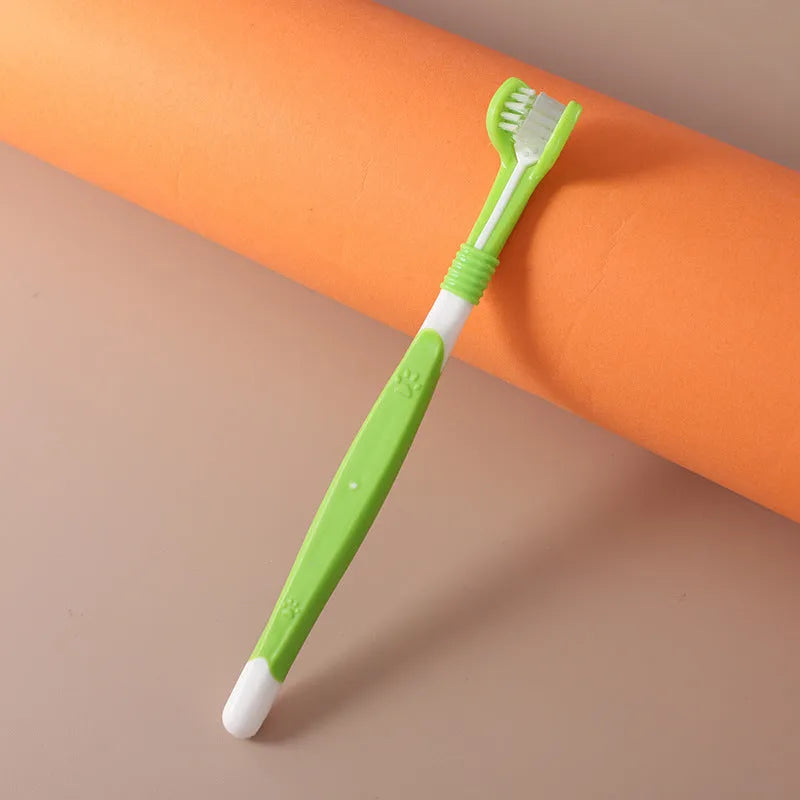 Pet toothbrush with soft nylon bristles on a plastic handle in various colour options for dogs and cats