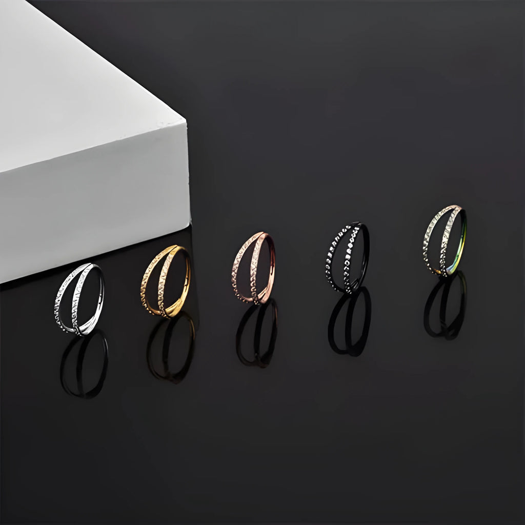 G23 titanium alloy lip and nose ring body jewellery in gold and steel colour finishes, showing different gauge sizes.