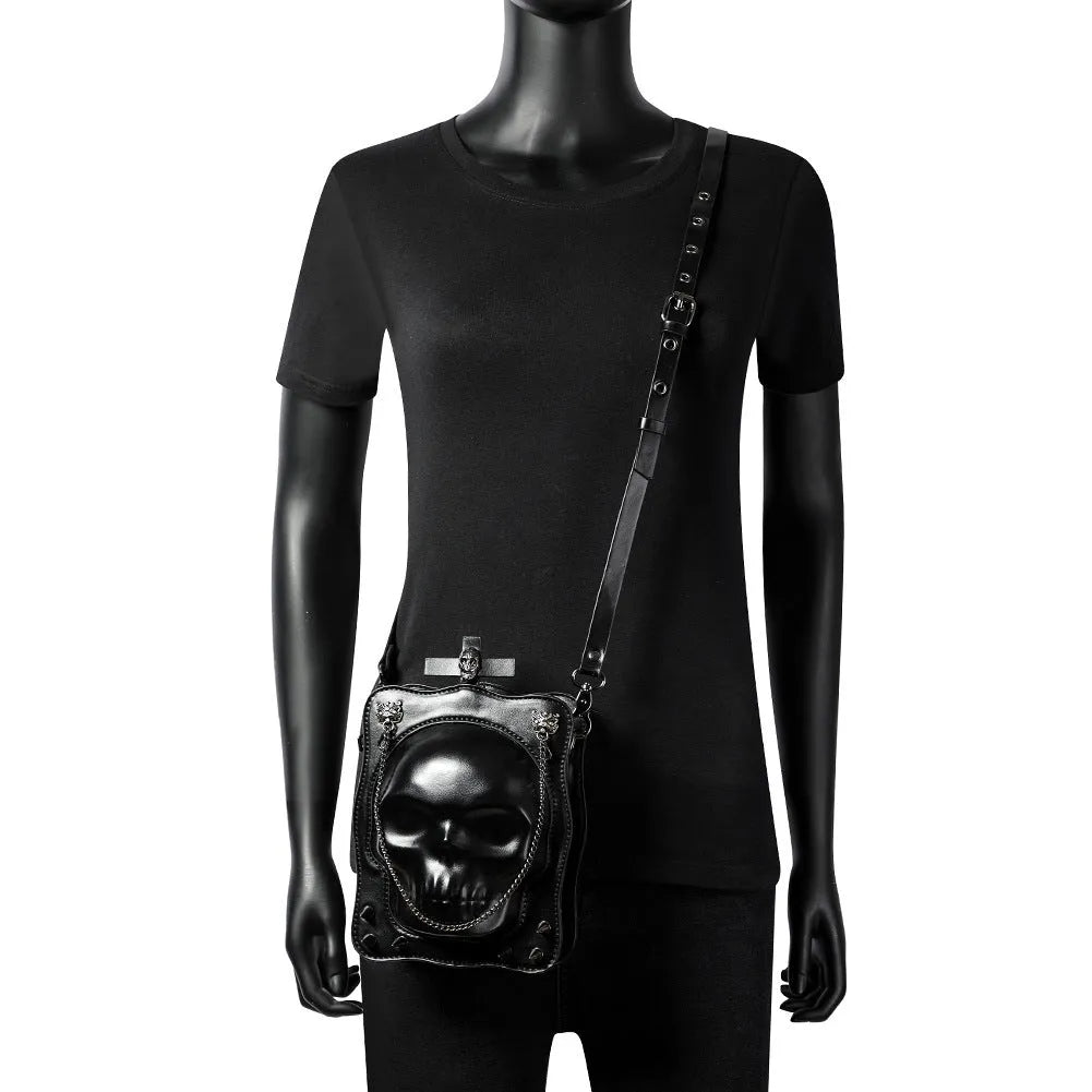 Black mini Halloween skull shoulder bag with zip closure, chain detail and phone pocket