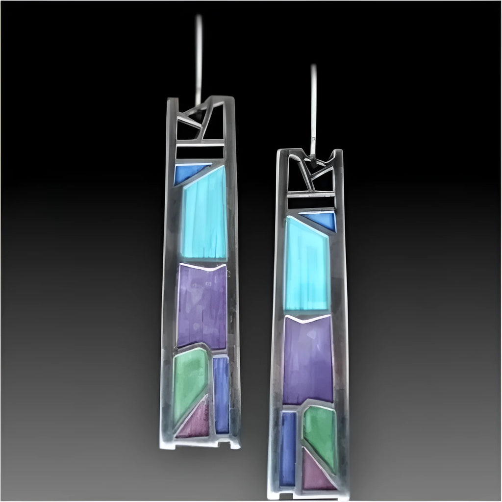 Silver coloured women's earrings with an irregular water drop shape made from alloy.