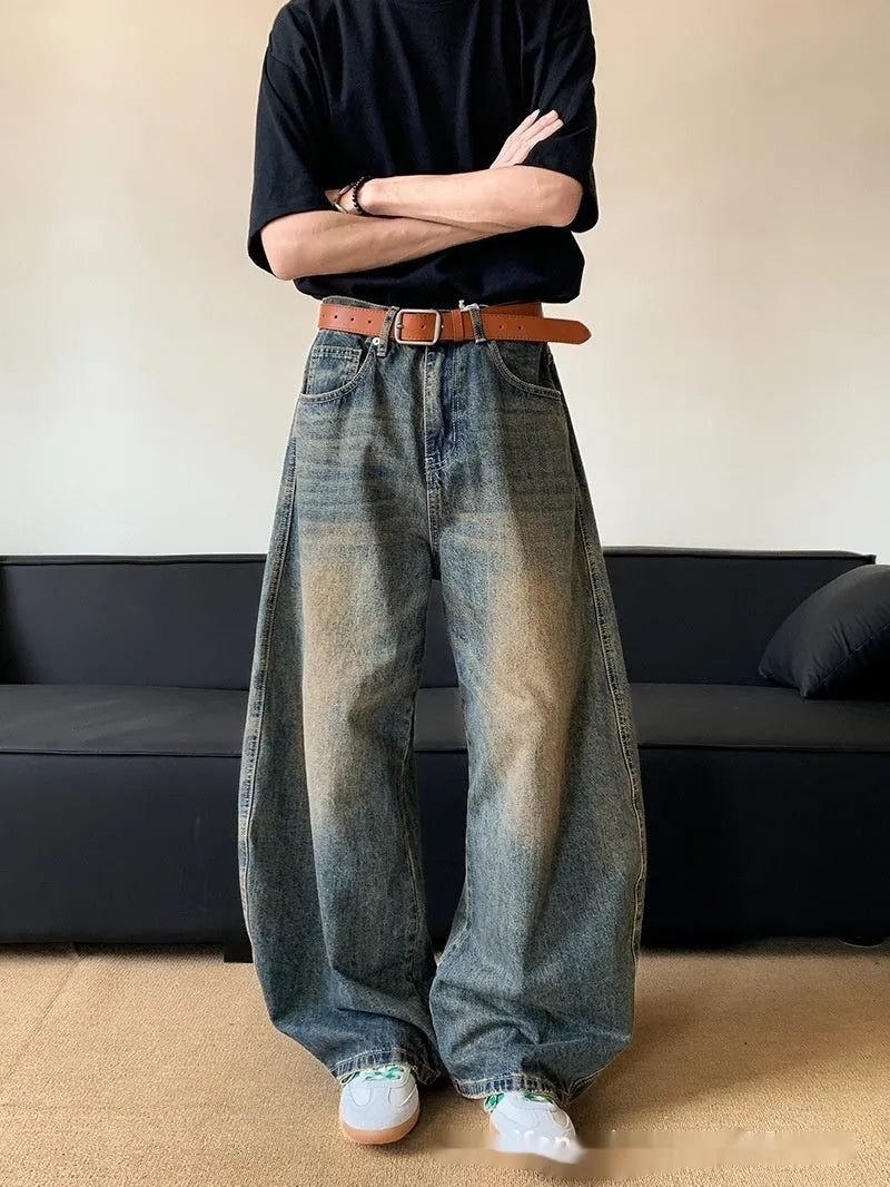 Men's distressed denim jeans in retro blue colour with wide-leg design and mid-waist fit