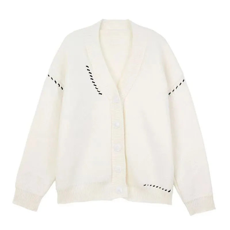 Women's loose-fit knitted cardigan coat in black or white, showing long sleeves and solid colour.