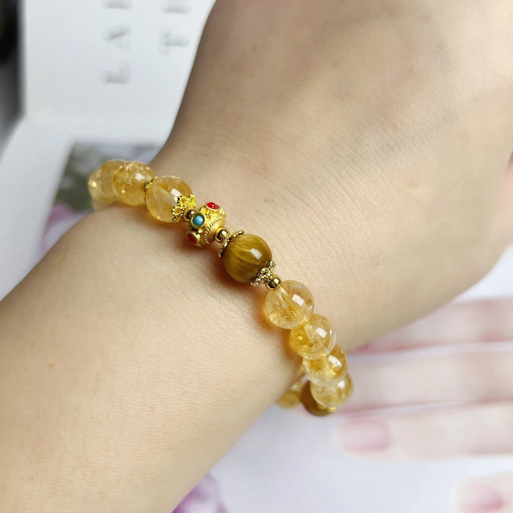 Handcrafted citrine crystal bracelet for women with a flower tassel in original design.