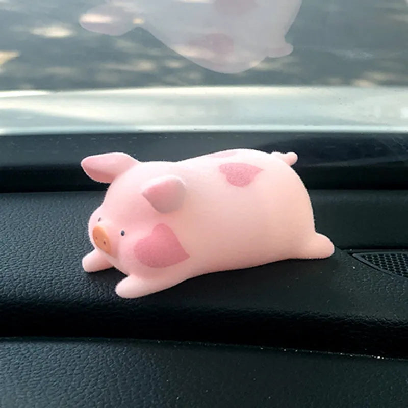 Cute cartoon pig resin figurine car dashboard ornament in one of eight available styles.