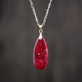 Emperor Stone water drop shaped jade pendant necklace with 18K gold plating on a chain.