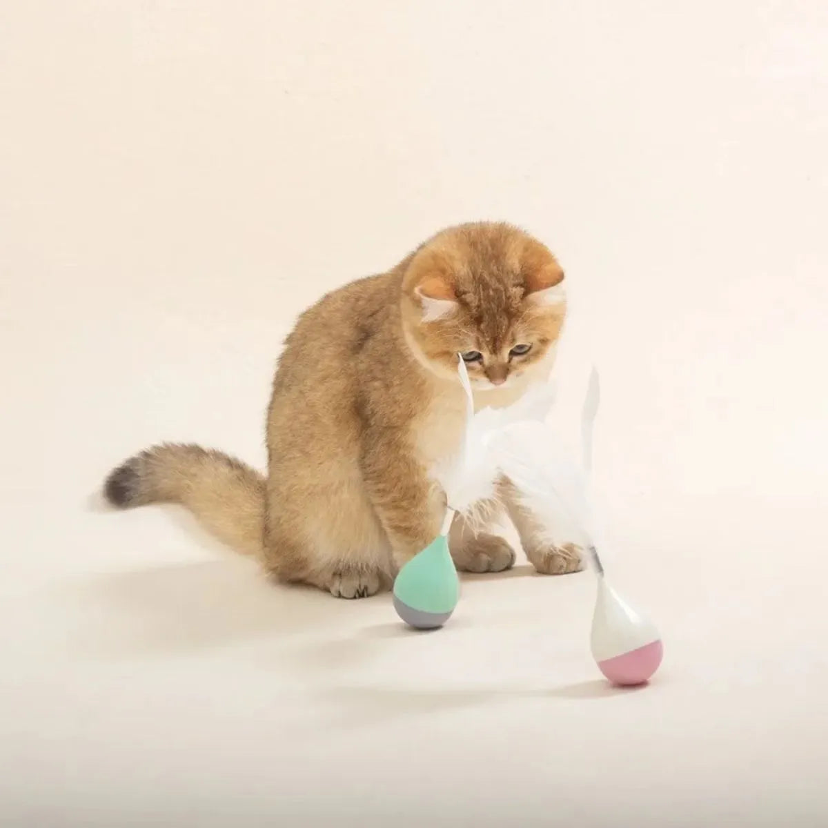 Green and pink feather tumbler cat toy with bite-resistant tease stick and goose feathers